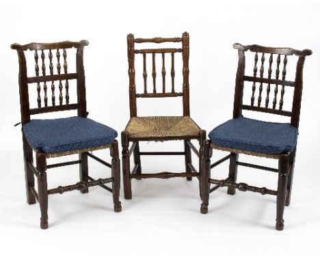 A pair of 19th Century rush seat spindle back chairs, another similar, a pair of 19th Century rush seat ladder back chairs an