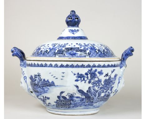 A 19th Century Nankin blue and white oval tureen with shaped mask head handles (one damaged), the cover with pierced finial, 
