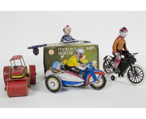 A tinplate clockwork motorcycle and side car by Metal King, boxed, a clockwork figure riding a bicycle, a steam roller etc.