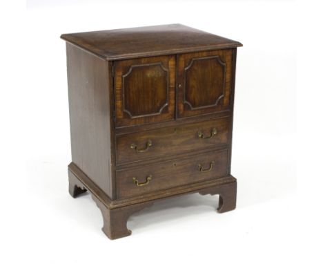 A George III mahogany pot cupboard fitted a cupboard above two drawers on bracket feet, 60cm wide