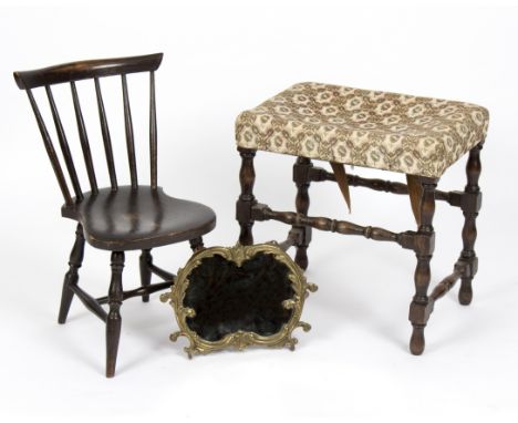 An upholstered stool on baluster supports, 50cm wide, a child's stick back chair and a small gilt metal framed mirror