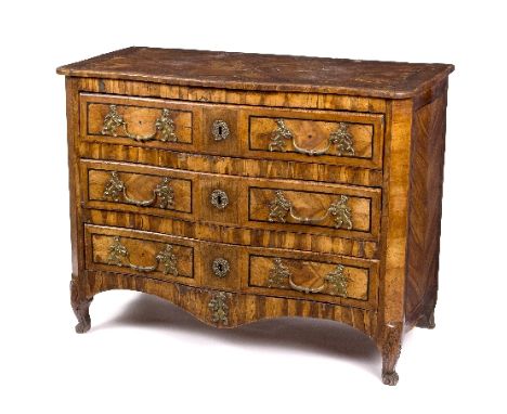 An early 18th Century Maltese olive wood and parquetry serpentine commode, the crossbanded top above three drawers with brass