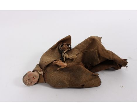 An Italian monastic doll in felt clothing with composition body, 43cm high, three puppet heads and three others