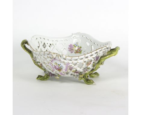 A Meissen rococo basket, circa 1765, with pierced sides, scrolling rim and with naturalistic handles and feet, painted floral