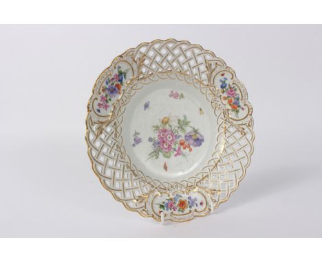 A Meissen reticulated cabinet plate, circa 1870, painted flowers, 24cm diameter 