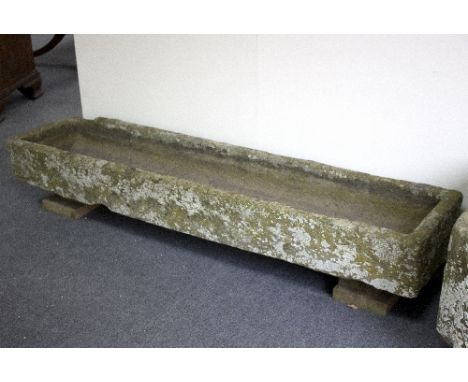 A rectangular stone trough of narrow proportions, 188cm x 34.5cm