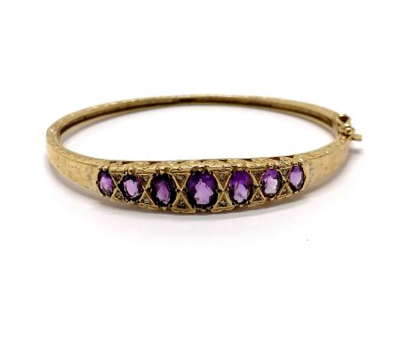 9ct marked gold amethyst &amp; diamond set bangle with engraved &amp; pierced detail to sides - 6cm across &amp; 12.9g total 