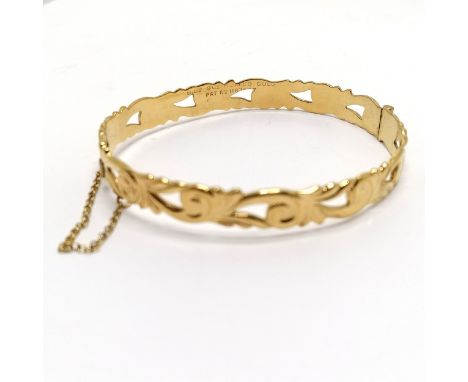 9ct rolled gold bangle with pierced detail - 6cm across &amp; 12.1g total weight 
