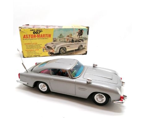 1966 Aoshin Co James Bond's 007 Aston-Martin battery operated tin plate car in original (a/f) box ~ the inside of the battery