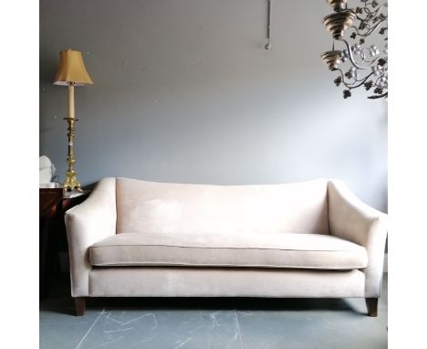Cream upholstered 3 seater sofa with swept back - 220cm long x 88cm high x 100cm deep - in good used condition apart from a m