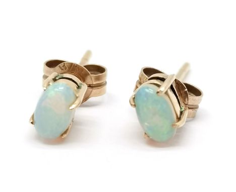 Gold (backs marked 375) opal stud earrings - total weight 0.8g &amp; opals approx 4.8mm long 
