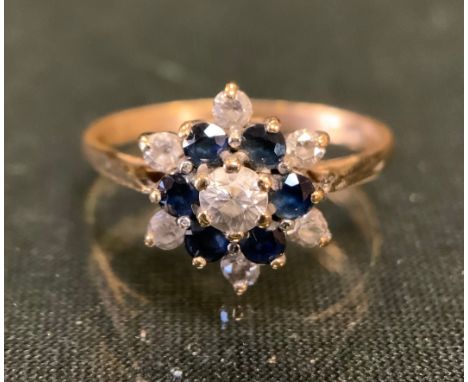 A 9ct gold cz and sapphire effect floral cluster ring, size N, 2.2g gross 