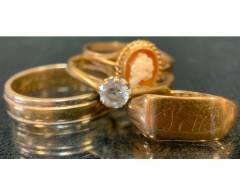 A 9ct gold wedding band, size O, 4.5 g;  9ct gold signet ring, 2.1g;  9ct gold cz dress ring;  cameo 9ct gold dress ring, 3.4