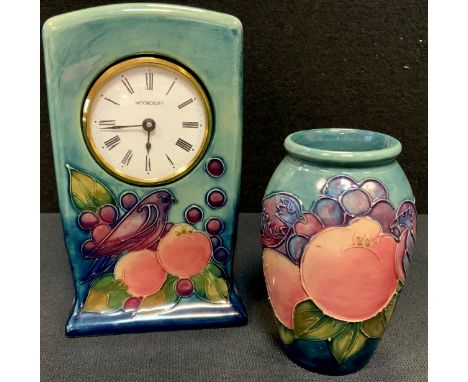 A Moorcroft Pottery mantel clock tube-lined in the Finches pattern, 16cm high; conforming vase,  10.5cm high, impressed and p