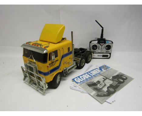 A Tamiya 1:14 scale kit built radio control Globe Liner Tractor Truck model No. 56304, with instruction manuals and Planet T5