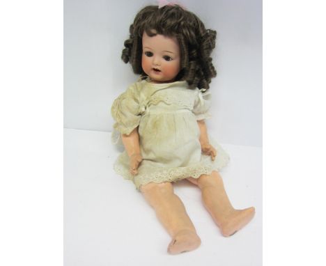 An Armand Marseille for Koppelsdorf bisque head girl doll with brown ringlet wig, brown glass sleepy eyes, painted features, 