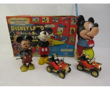 A collection of vintage Mickey Mouse toys to include two Masudaya tinplate cars, Marx Hong Kong made plastic clockwork walkin