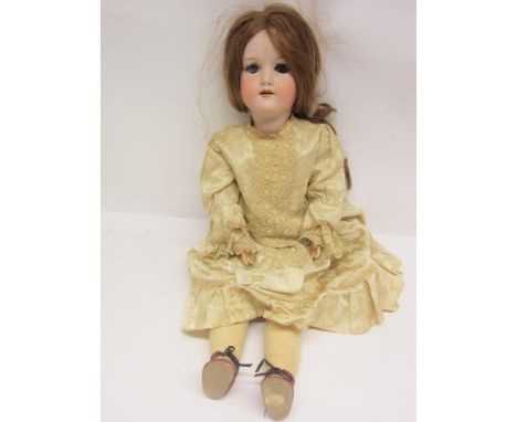 An early 20th Century Armand Marseille bisque head girl doll with strawberry blonde wig, striated blue glass sleepy eyes, pai