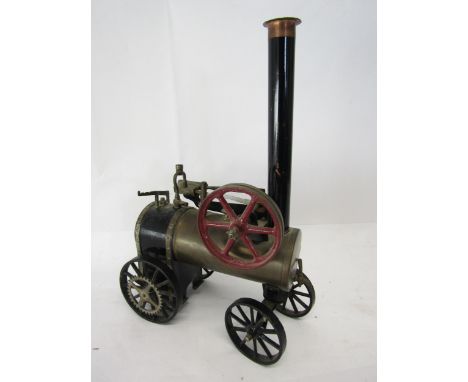 A scratch built live steam model of a portable engine, the brass horizontal boiler with sight glass and steam whistle, single