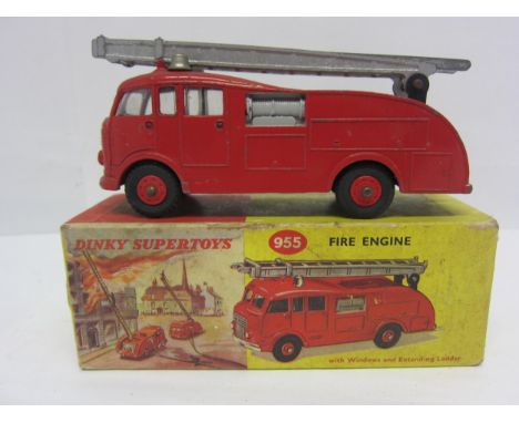 A boxed Dinky Supertoys diecast 955 Fire Engine with Extending Ladder, finished in red with plastic hubs, silver trim and lad