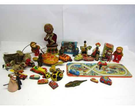 A collection of mostly playworn tinplate and mechanical novelty toys and vehicles including English made horse (missing rider