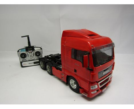 A Tamiya 1:14 scale kit built radio control MAN TGX 26.540 6x4 XLX Tractor Truck No. 56325, with instruction manuals and Plan