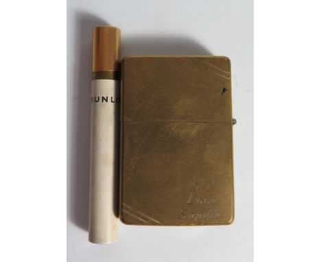 A Dunlop Cigarette Lighter in the form of a cigarette and brass cased Zippo