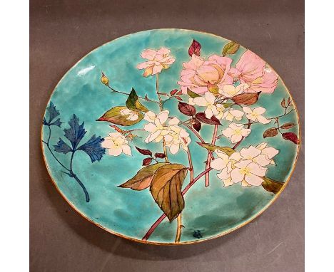 A Minton Art Pottery Studio earthenware charger, 1871 - 1875 painted with roses and blossoms (Dia38.5cm)