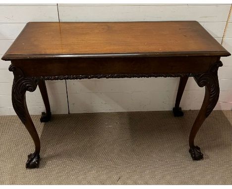 A mahogany console table with ball and claw feet (H89cm W122cm D48cm)