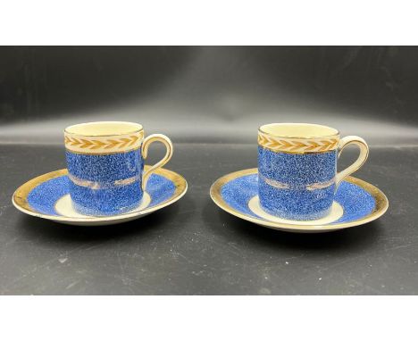 A pair of Crown Ducal coffee cans and saucers 