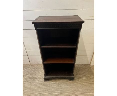 An open bookcase on bracket feet 