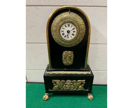 An ebony mantle clock AF