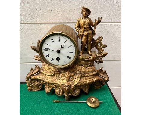 A French mantle clock in gilt with a young man stood on the right AF 