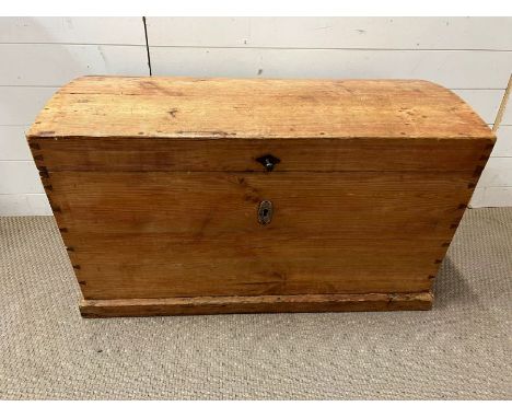 An antique pine trunk with iron metal work handles (H57cm W94cm D52cm)