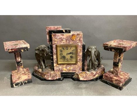 An Art Deco elephant themed pink marble clock and garniture (Pendulum is missing)