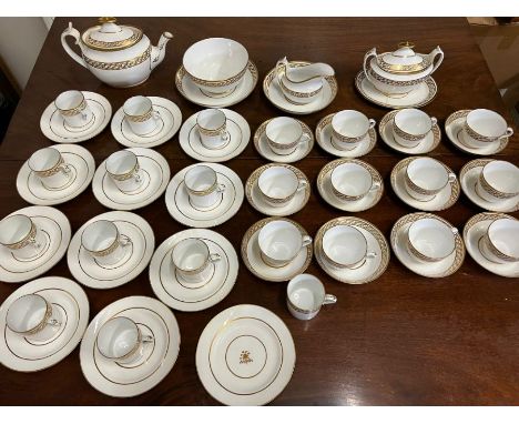 A white and gilt tea service, twelve tea cups, twelve coffee cans, twelve saucers, twelve side plates, teapot and stand, suga