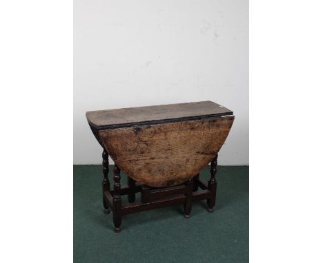 20th century oak drop leaf gate leg table, raised on turned legs and plain stretchers, 94cm wide 73cm high&nbsp;