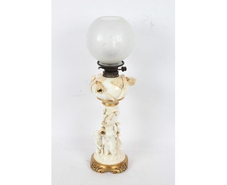 19th century Moore &amp; Co porcelain oil lamp, with a opaque shade above a white porcelain reservoir above a floral body wit