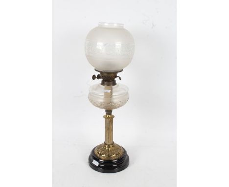 Victorian oil lamp, with a opaque glass shade above a cut glass reservoir and a brass reeded column set on a black base, 61cm