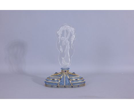 Clear blue glass bottle, gold lace like at the bottom of he bottle with tiny blue gems. Iny pearl like gems and small little 