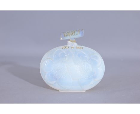 "Voeu de Noel" a CRISTALLERIE DE ROMESNIL perfume bottle for Caron, circa 1939, in opal crystal with gilt name label (Caron -