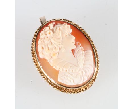 9ct gold cased cameo brooch of a female facing ring, 4cm x 3cm, 13.2g gross. 