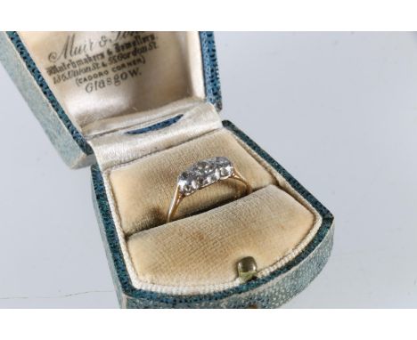 Yellow gold and platinum (unhallmarked) three stone diamond ring, size M, 1.7g, in antique box. 