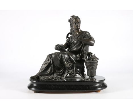 Cast metal figure of a Roman or Greek classical figure positioned sat reading a scroll, upon ebonised wooden base, 29cm long.