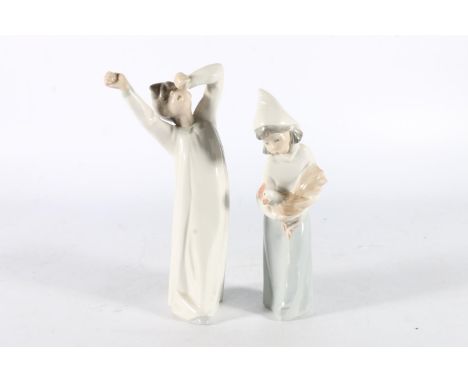 Two Lladro of Spain porcelain figurines, one modelled as a girl with cockerel, the other a boy in nightgown yawning, 19cm and