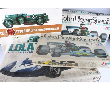 Tamiya 1:12 scale BS1215 Lola T-70 mkIII model kit, two Tamiya 1:12 scale BS1213 John Player Special Lotus 72D model kits and