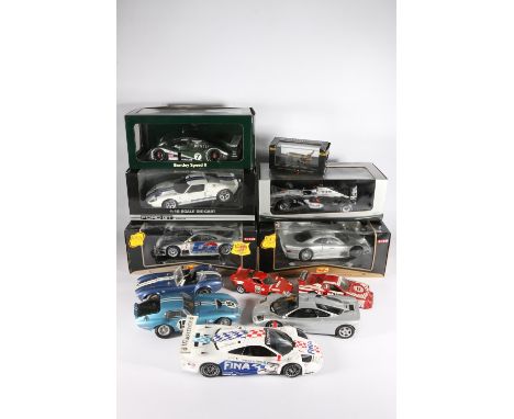 Five boxed diecast model vehicles to include an Auto Art Moddels Bentley Speed 8, a Pauls Model Art West McLaren Mercedes for