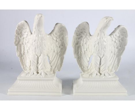 Pair of white glazed porcelain eagles, 22cm tall. (2) 