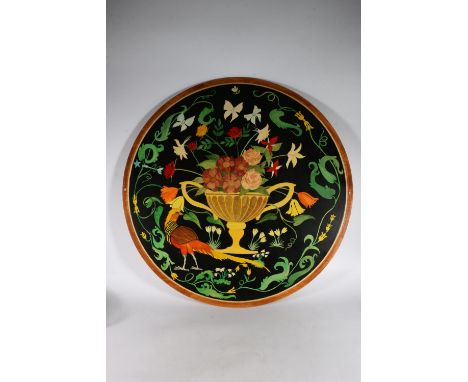 Painted plywood circular panel depicting a urn of flowers within a wreath with butterflies and insects, 81cm 