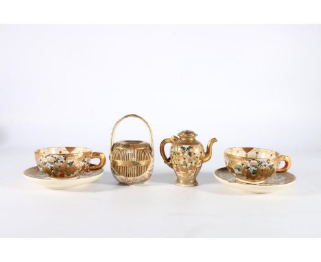 Japanese Satsuma pottery including a miniature teapot, basket and a pair of cups and saucers, (damages). Teapot badly damaged